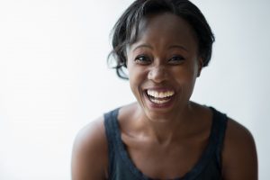 Woman smiling because of Invisalign